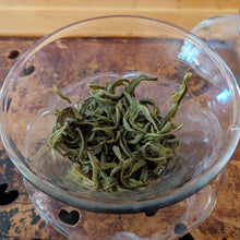 Hui Long green tea spent leaves in a glass gaiwan 